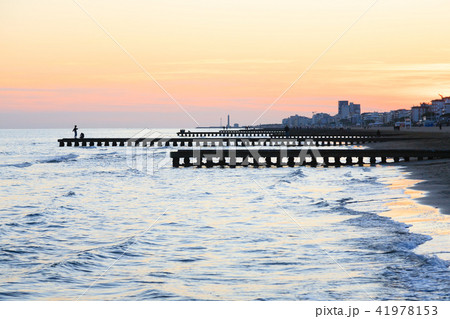 Beach at dawn, piers perspective view 41978153
