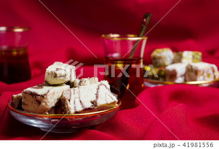 Halva with cacao and tea on a plate Halva with cacao and tea on a plate 41981556