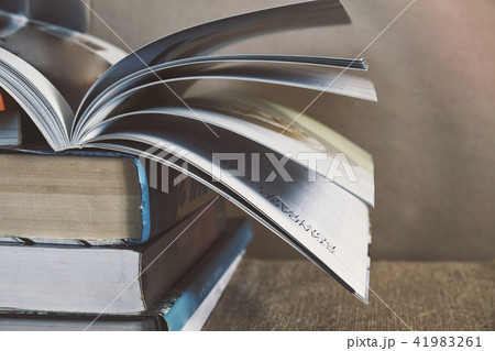 textbook stack on sackcloth with book turning page 41983261