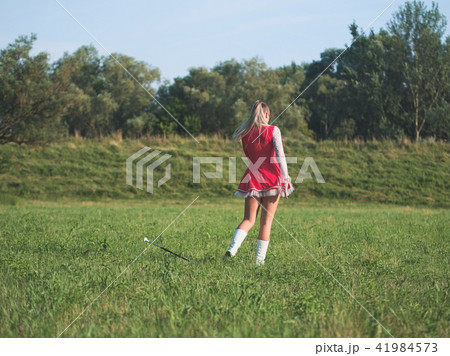 Teen Majorette Girl Twirling Baton Outdoors Teen Majorette Girl Twirling Baton Outdoors 41984573