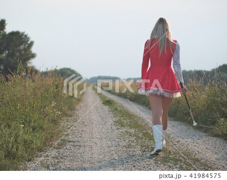 Teen Majorette Girl Twirling Baton Outdoors Teen Majorette Girl Twirling Baton Outdoors 41984575