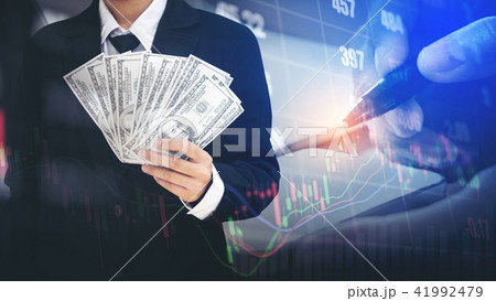 Businessman Holding money US dollar bills 41992479