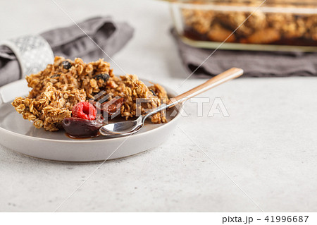 Crumble cake with plum and raspberries 41996687