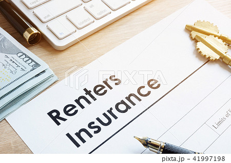 Renters Insurance form on a table and keys. 41997198
