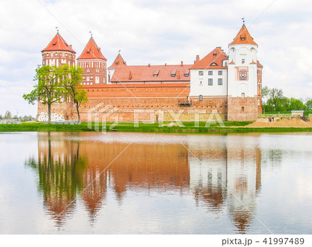 Mir, Belarus. Castle Complex Mir On Sunny Day with blue sky Background. Old medieval Towers and Mir, Belarus. Castle Complex Mir On Sunny Day with blue sky Background. Old medieval Towers and 41997489