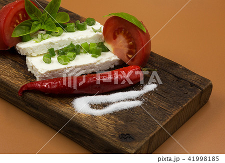 Slices of white cheese with chives Slices of white cheese with chives 41998185