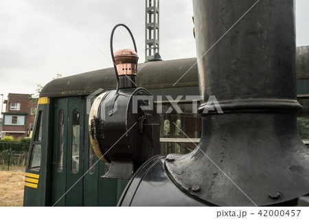 old steam train with a large oil lamp old steam train with a large oil lamp 42000457
