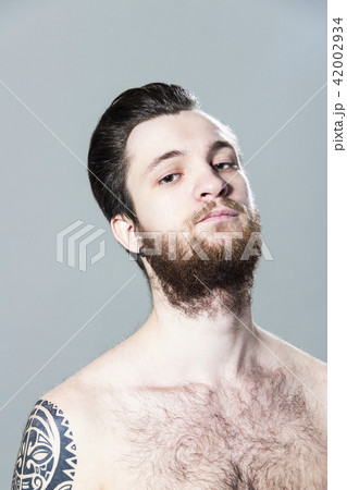 sexy inked hairy young man with tattoo and beard sexy inked hairy young man with tattoo and beard 42002934