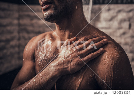 Close up. Young Afro-American Man Taking Shower. 42005834