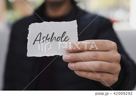 man showing a note with the word askhole in it 42009292
