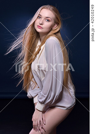 Sexy Woman with long blowing hair Sexy Woman with long blowing hair 42010249