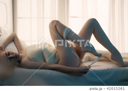 Sensual blonde in her boudoir Sensual blonde in her boudoir 42015261
