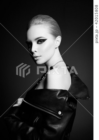 Woman with bright makeup in leather jacket 42015808