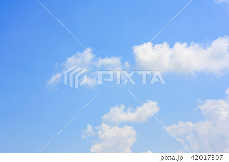 Fluffy cloud against blue sky background Fluffy cloud against blue sky background 42017307