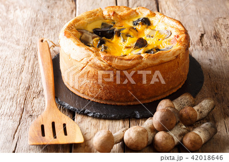 Delicious savory pie with wild mushrooms, cheddar 42018646