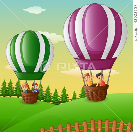 Happy cartoon kids flying in a hot air balloon Happy cartoon kids flying in a hot air balloon 42022557