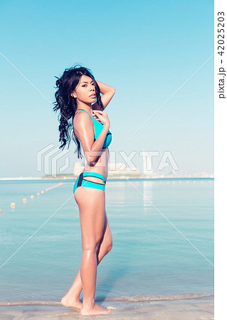 Woman in vacation on beach Woman in vacation on beach 42025203