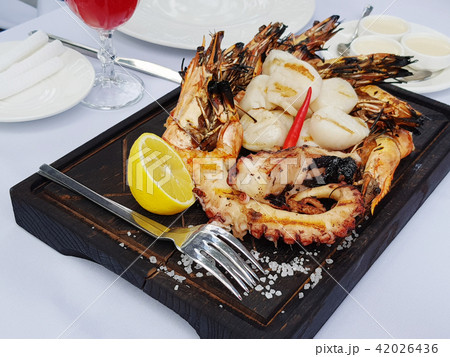 Grilled seafood plate with shrimp and octopus Grilled seafood plate with shrimp and octopus 42026436
