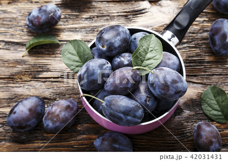 plum on a wooden background plum on a wooden background 42031431