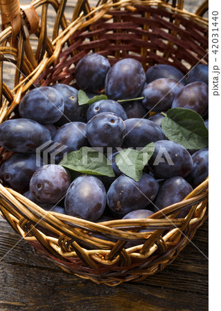 ripe plum in a basket 42031440