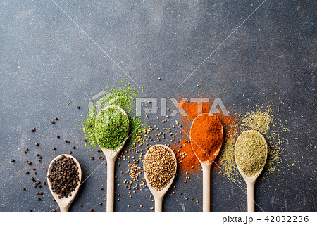 Herbs and spices on gray stone table 42032236