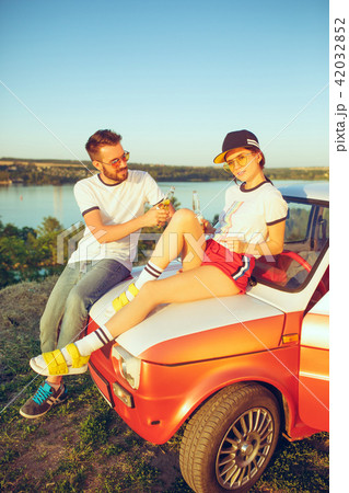 Couple resting on the beach on a summer day near river. Love, happy family, vacation 42032852
