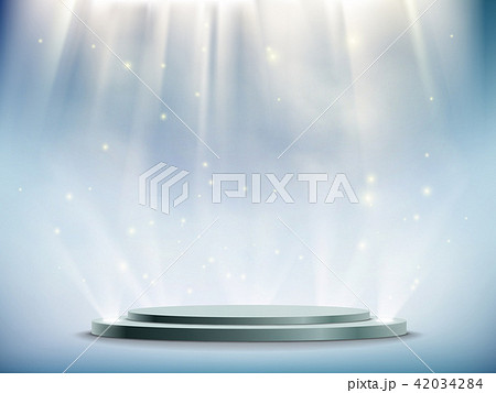 round podium illuminated by searchlights. 42034284