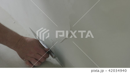 closeup worker applying decorative concrete plaster on the wall closeup worker applying decorative concrete plaster on the wall 42034940