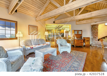 Bright, open and warm living room with vaulted 42037528