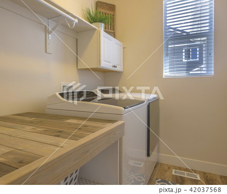 Clean laundary room in model home in Utah Valley 42037568