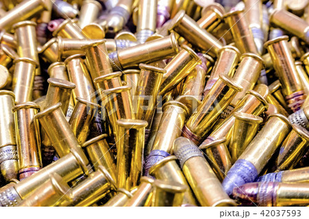 Closeup pile of bullets shiny 42037593