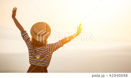 Happy woman jumping and enjoying life at sunset in mountains. Happy woman jumping and enjoying life at sunset in mountains. 42040098