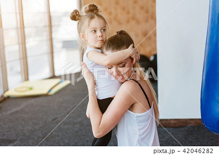 Mom hugs her little daughter Mom hugs her little daughter 42046282