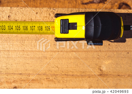 measuring tape on wood measuring tape on wood 42049693