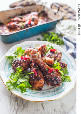 Grilled roasted and barbecue chicken legs Grilled roasted and barbecue chicken legs 42049874