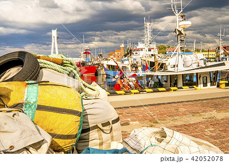 Fishing port of Ustka, Poland with old lighthouse 42052078