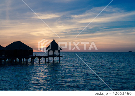 View of a resort with bungalows over Indian Ocean View of a resort with bungalows over Indian Ocean 42053460
