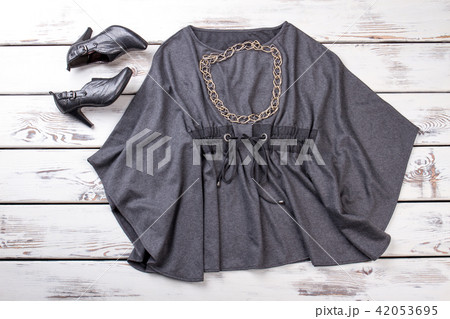 Gray blouse and black high heel shoes, flat lay. Gray blouse and black high heel shoes, flat lay. 42053695