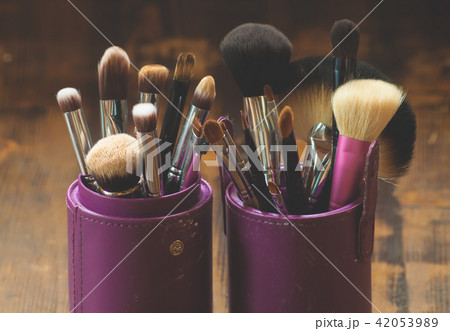Professional makeup brushes in tube. 42053989