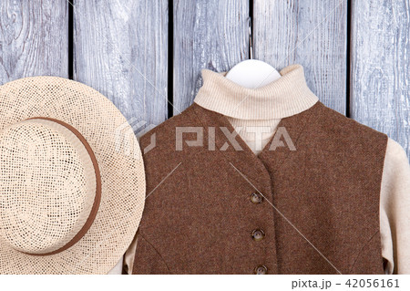 Top view straw and winter clothing. 42056161