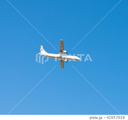 Passenger plane flying in the blue sky 42057029
