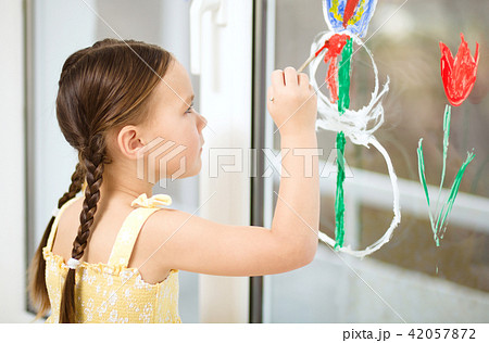 Portrait of a cute girl playing with paints Portrait of a cute girl playing with paints 42057872