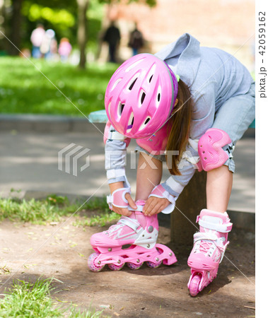 Little girl is wearing roller-blades Little girl is wearing roller-blades 42059162