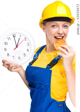Young construction worker is going to lunch Young construction worker is going to lunch 42059472