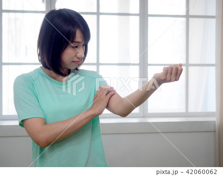 Woman checking her body Woman checking her body 42060062