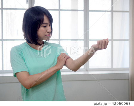 Woman checking her body Woman checking her body 42060063