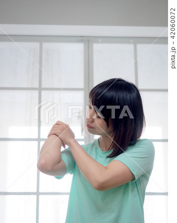 Woman checking her body Woman checking her body 42060072