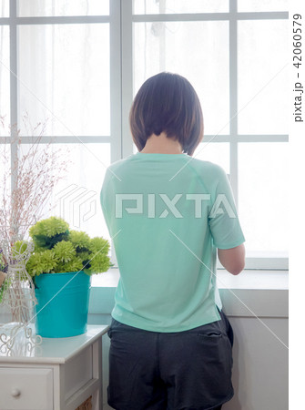 Back view of a Young girl with digital tablet in h Back view of a Young girl with digital tablet in h 42060579