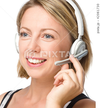 Lovely young woman is talking to customers Lovely young woman is talking to customers 42061730