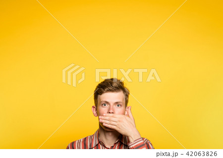omg man cover mouth hand amazing astonishing 42063826